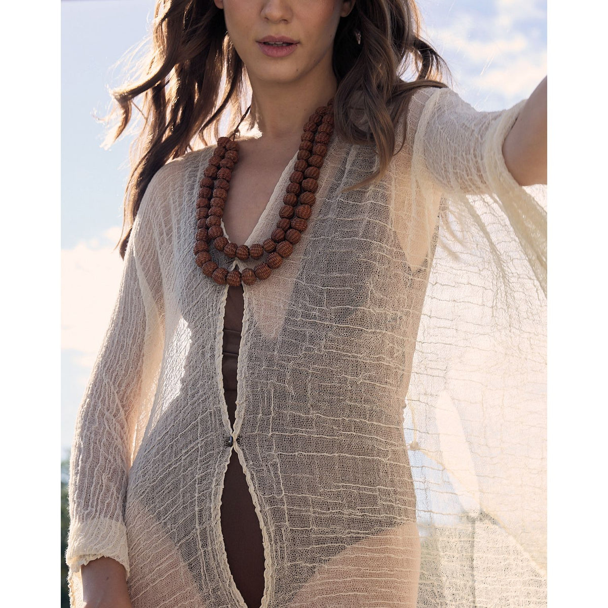 Double strand bolitas necklace in brown